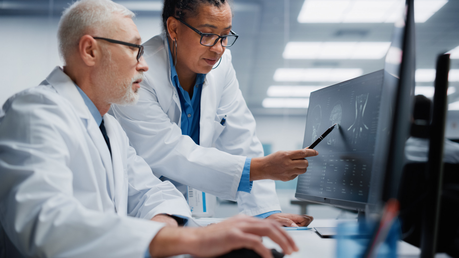 Two doctors examining the severity of a brain injury